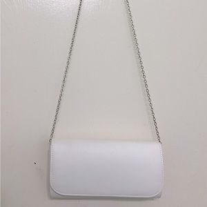 white purse with silver chain
